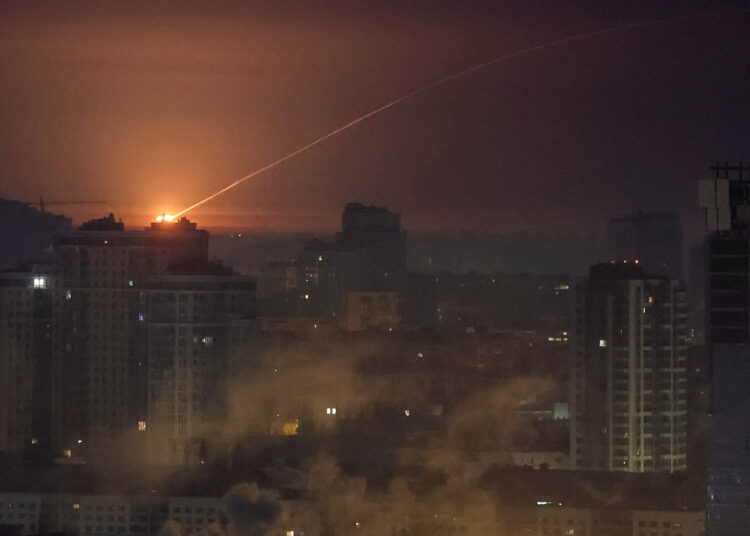 Ukrainian servicemen shoot down a Russian missile during a Russian missile and drone strike, amid Russia's attack on Ukraine, in Kyiv, Ukraine January 20, 2026. REUTERS/Gleb Garanich
